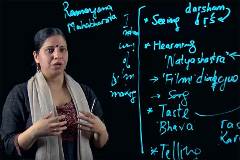 Instructor giving a lecture with the lightboard