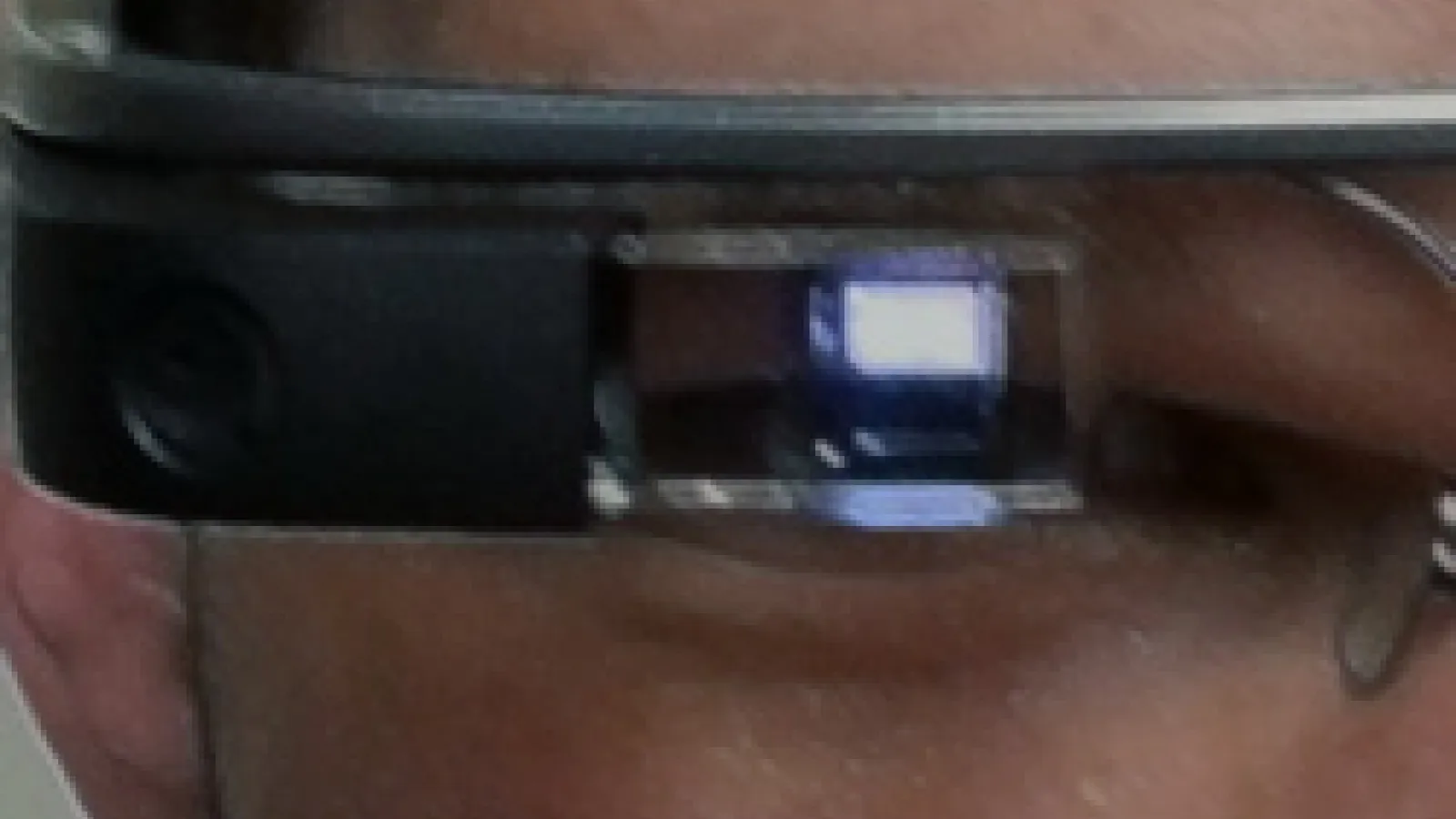 Extreme closeup of Google Glass wearer