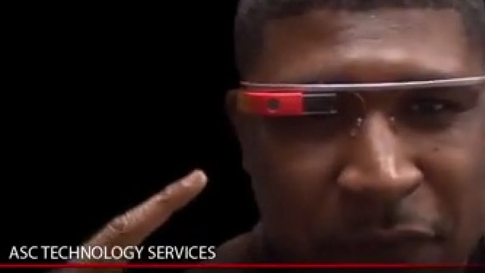 ASC Tech Coordinator Allen Coleman pointing to Google Glass he's wearing
