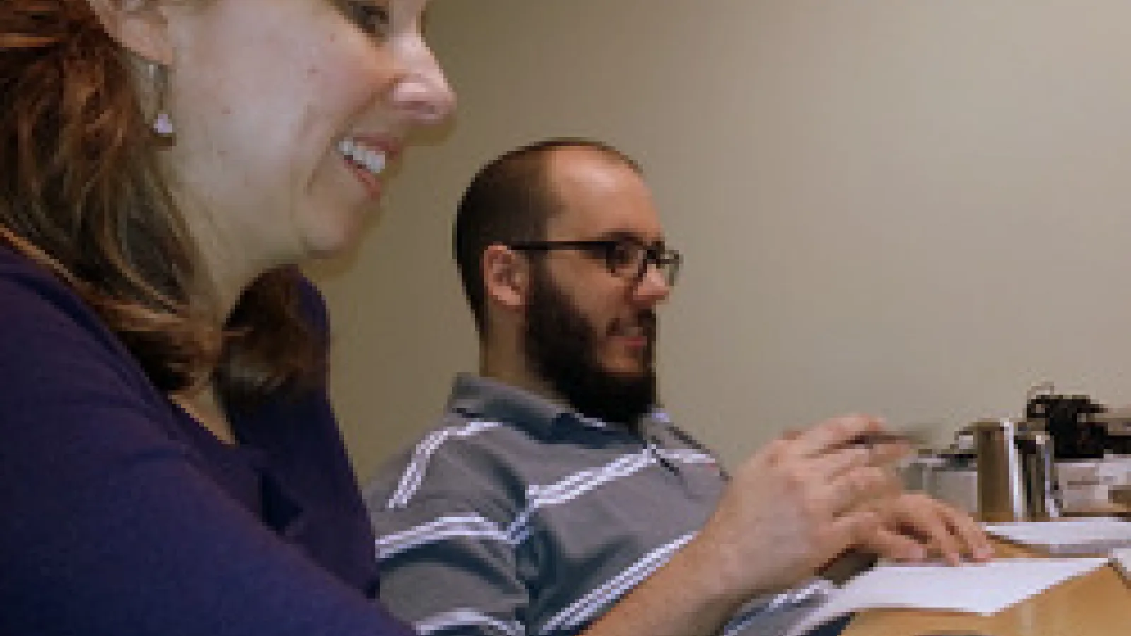Eva Dale and Dustin Perzanowski in front of computer