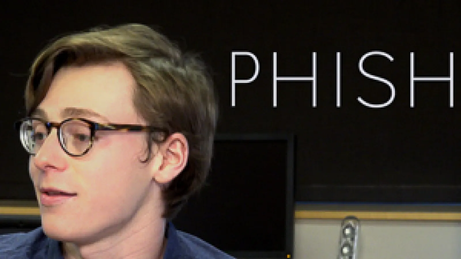 Phishing video still with student and Phish text
