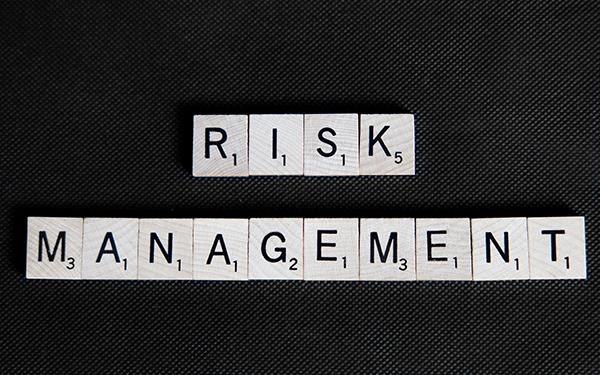 Risk Management spelled out in Scrabble tiles. Photo Credit Jason Dale