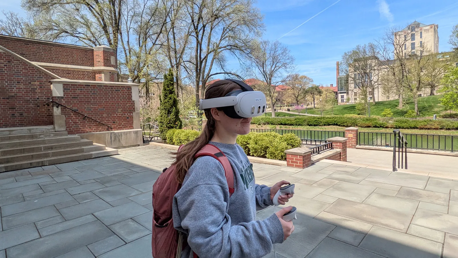 Student wearing a VR headset outside
