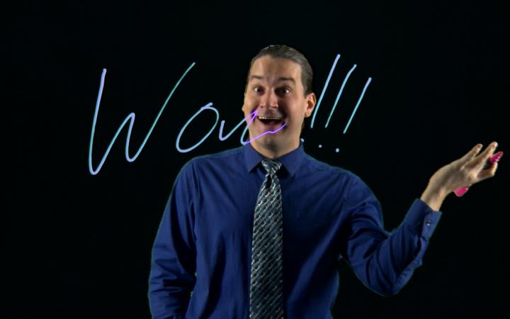 Mike Bierschenk writing on lightboard