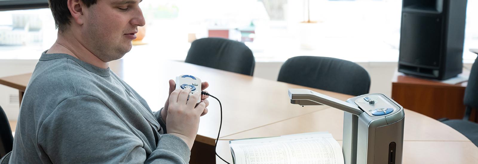 Blind student working at his desk